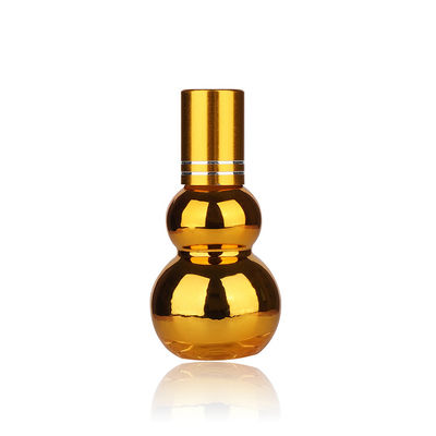Botellas de rodillo vacías de aceite esencial con bola rodante de metal dorado con forma de calabaza UV de lujo de 50 ml y 100 ml